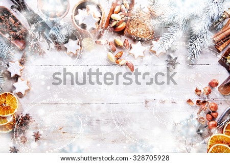 White Christmas Background with empty copy space. Cakes and nuts as a decorative xmas frame for xmas concept or cards