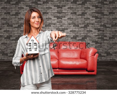 happy young woman with house