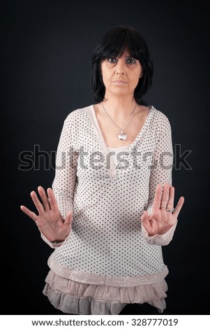 beautiful woman doing different expressions in different sets of clothes: stop sign