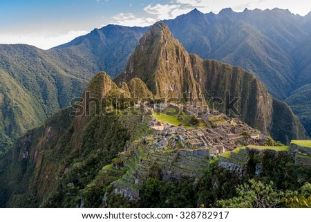 Aerial view of famous Mach Picchu ruins, Wayna Picchu mountain in the background.