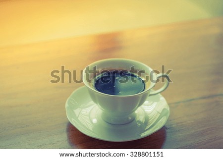 Espresso Coffee cup on wood table ( Filtered image processed vintage effect. )