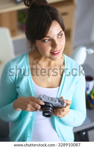 Woman is a proffessional photographer with camera