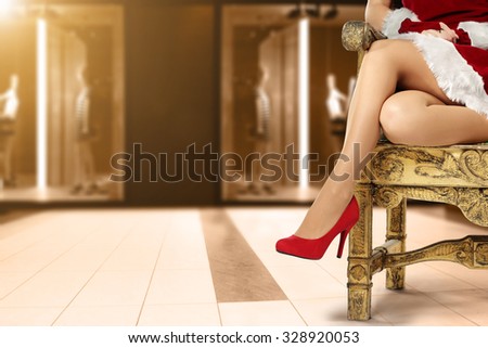 golden chair woman legs and red heels and shop interior with brown floor 