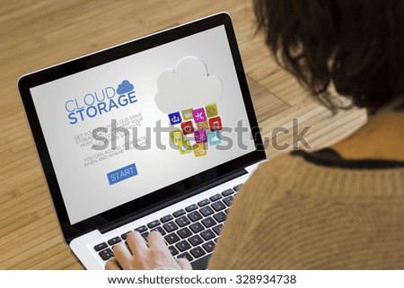 storage concept: cloud drive storage on a laptop screen. Screen graphics are made up.