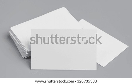 blank business cards on grey background for text and logo