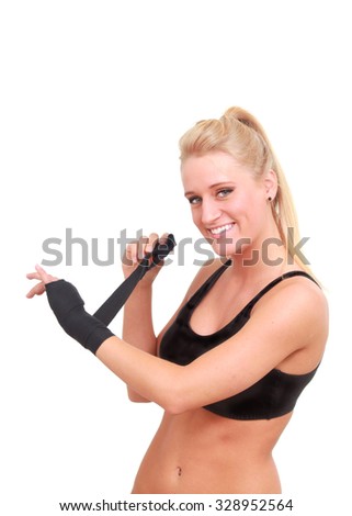 Woman wraps her hands before a fight