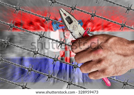 Croatia flag, migrants and barb wire with pliers
