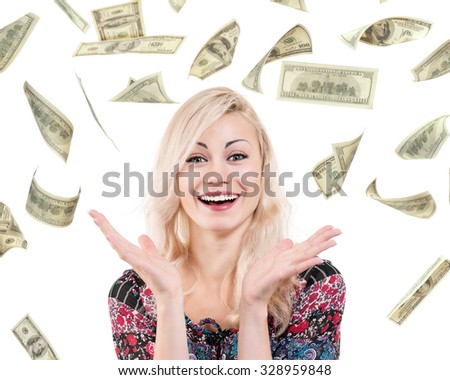 Portrait of young excited woman under a money rain - isolated on white background