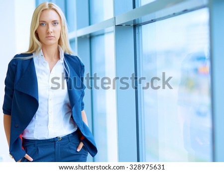 Young businesswoman standing in business center