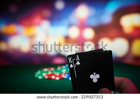 Poker chips with cards on table in casino