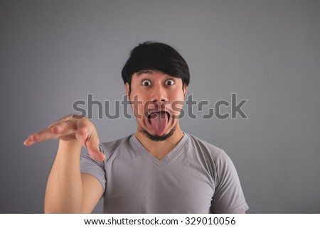 Asian man is making funny scary face.