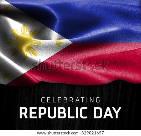 Philippines flag and Celebrating Republic Day Typography on wood background