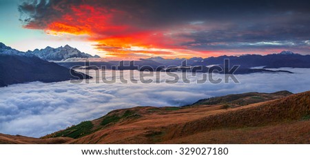Foggy autumn morning at the foot of Mt. Tetnuld. Upper Svaneti, Mestia, Georgia, Europe. Caucasus mountains. October 2015.