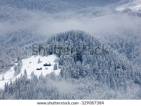 Small house in winter mountains