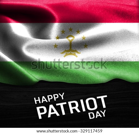 Happy Patriot Day Tajikistan flag on wood Texture background