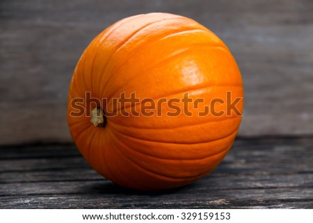 Fresh Pumpkin  on old wooden table .