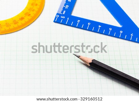 Pencil and Ruler on green graph paper with copy space , Selective focus