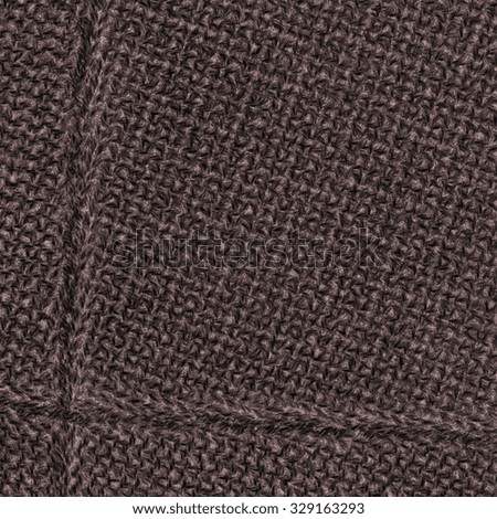 brown textile background decorated with seams