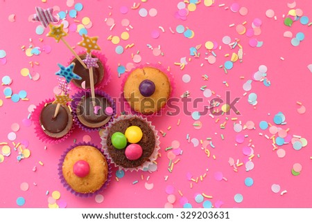 Cupcakes on pink confetti background - happy birthday card