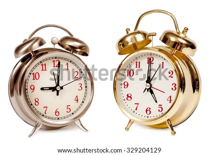 Two Alarm Clocks Showing Business Concept of working ' 9 to 5'/  Alarm Clocks Reading Nine and Five O'clock Isolated/ Working 9 to 5 Royalty-Free Stock Photo #329204129