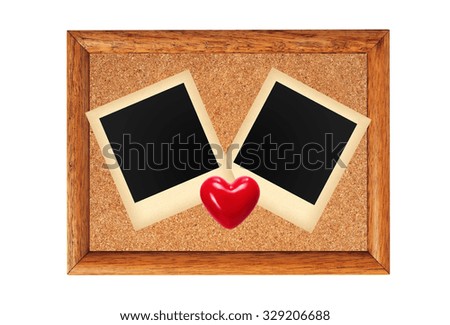 Wooden frame with blank old photo and red heart isolated on white