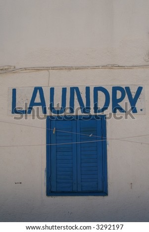 laundry sign, hand painted on the wall