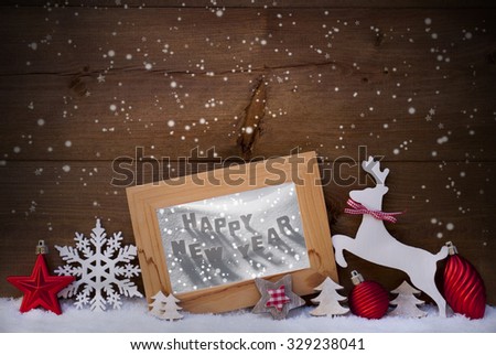 Christmas Card With Picture Frame On Snow. Englisch Text Happy New Year. Red Christmas Decoration Like Christmas Ball, Snowflakes, Tree, Star And Reindeer. Wooden And Vintage Background