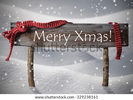 Brown Wooden Christmas Sign On White Snow. Snowy Scenery, Snowflakes. Red Ribbon, English Text Merry Xmas. Christmas Card. Rustic Or Vintage Syle