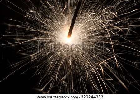 sparkler or Bengal fire on a dark background