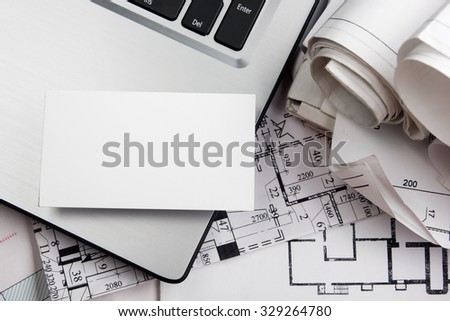 White blank business visit card corporate identity pass with template for ID. Real Estate Concept. Architectural workplace - project, blueprints, calculator, divider compass on construction plans.