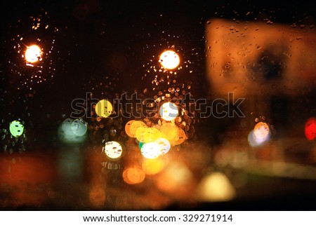 blurred background night city lights flashing drops