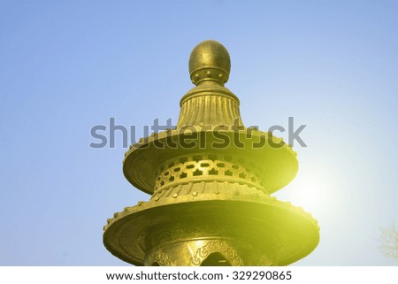 bronze incense burner in a temple, closeup of photo
