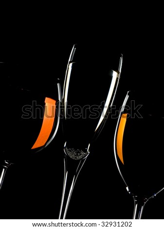 glasses of wine and champagne isolated on black background