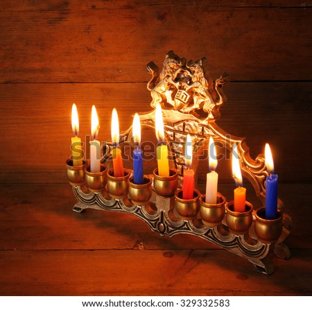 low key image of jewish holiday Hanukkah with menorah (traditional Candelabra) 