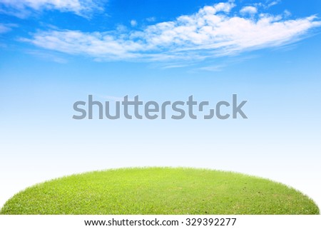 Circle green grass landscape view in sunshine, park field nature scenery with white clouds sky background