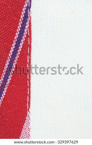 white cotton fabric texture background stack with red tab fabric thread sewing together vertically