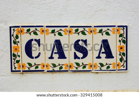 CASA ("Home" or "House" in Spanish, Italian or Portuguese) ceramic tiles vintage sign on the old stone wall.