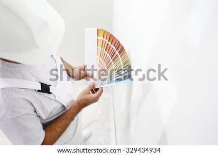painter man with color swatches in your hand 