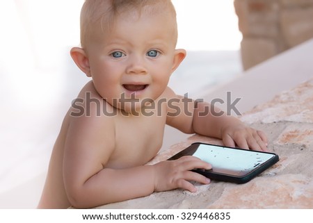 Picture of baby playing outdoors, love and happiness concept