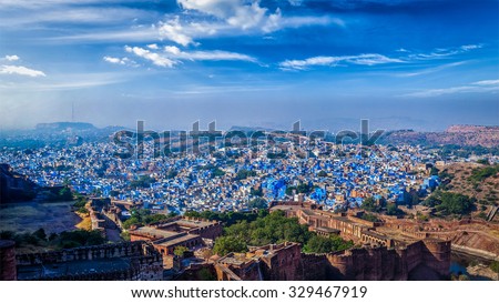 Panorama of Jodhpur, also known as "Blue City" due to the vivid blue-painted Brahmin houses. View from Mehrangarh Fort (part of fortifications is also visible).  Jodphur, Rajasthan, India