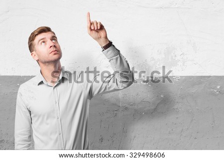 happy businessman pointing up