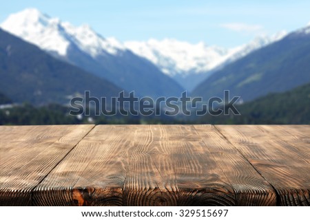 wooden desk space and mountains 