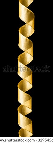 Spiraling Christmas ribbon isolated on black background