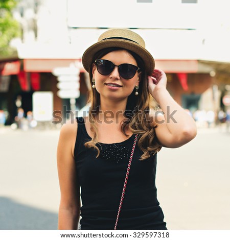 Beautiful joyful young woman enjoying her Paris travel. Fashion young blonde woman portrait