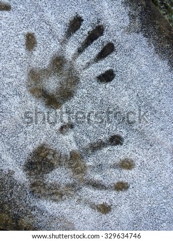 Child handprints in ice