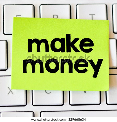 Make money. Memo with make money on white keyboard