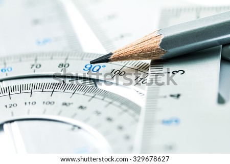 extremely selective focus a part of the silver pencil and precision measurement tool , concept of construction or building design drawing idea