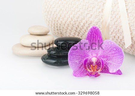 Spa theme - stones and an Orchid flower