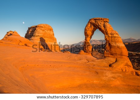 View of the famous Delicate Arch at sunset in Utah, USA. Royalty-Free Stock Photo #329707895