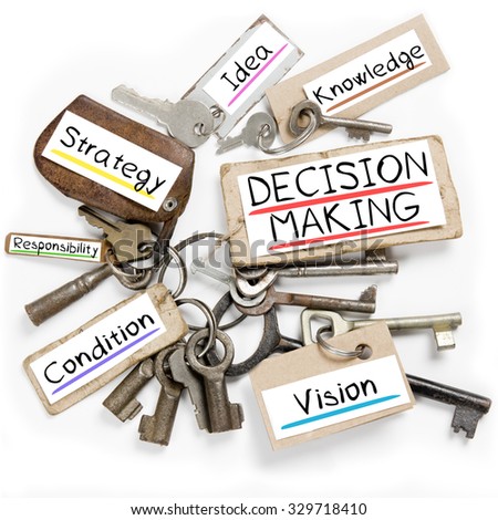 Photo of key bunch and paper tags with DECISION MAKING conceptual words